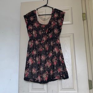 Small black dress with beige under shirt underneath